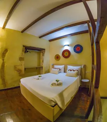 a bedroom with a large bed in a room at Mythos -Old Town-Old harbour Chania in Chania Town