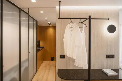 a white dress hanging on a wall in a room at KT Suites in Chania Town
