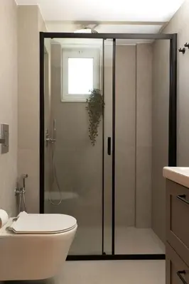 a bathroom with a shower with a toilet and a sink at kolymvari4you in Kolymvari