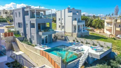 an aerial view of a house with a swimming pool at Villa ViKaDa in Stalos