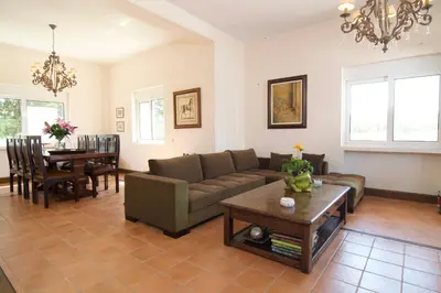 a living room with a couch and a table at Villa Ektor in Kissamos