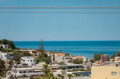 a view of a city and the ocean at Zen Maisonette Retreat in Daratso