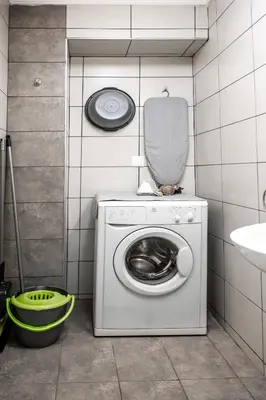 a washing machine in a bathroom with a sink at Kamari Apartment - Chania in Chania Town