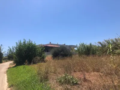 a dirt road with a house in the background at Solar Retreat Maleme in Maleme