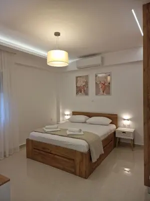 a bedroom with a large bed in a room at Thomas & Lukas Apartment in Chania Town
