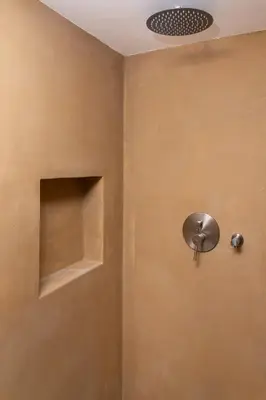 a bathroom with a shower with a shower head at Lyria Hotel Apartments in Stalos