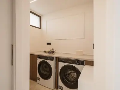 a laundry room with a washer and dryer at Aeri Residence in Chania Town