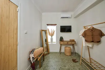 a hallway with a dressing room with a mirror and a table at Atria Serenity Stay in Chania Town