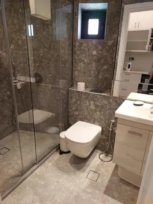 a bathroom with a toilet and a shower at The Nest in Chania Town