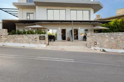 a house on the side of a street at Palea Luxury Living in Galatás