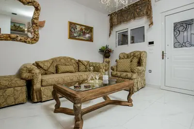 a living room with a couch and a coffee table at Theodosia Heritage Residence in Kissamos