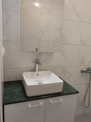 a bathroom with a white sink and a mirror at Villa 
