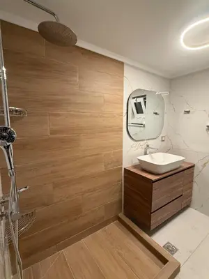 a bathroom with a sink and a mirror at Eteà Sea Penthouse-In the heart of chania in Chania Town