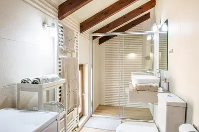 a bathroom with a toilet and a sink at Villa Rose in Chania Town