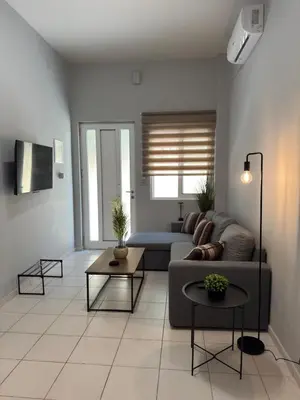 a living room with a couch and a table at Unique Apartment 3 in Chania Town