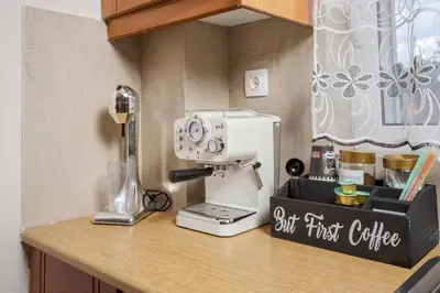 a kitchen counter with a sewing machine on a counter at Sellianos Apartment In Kalyves -BY APOKORONAS VILLAS in Kalyves
