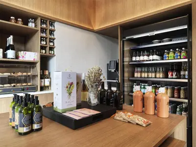 a bar with bottles of wine on a wooden counter at Hilton Garden Inn Chania City in Chania Town