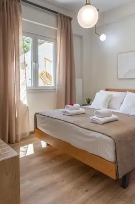 a bedroom with a bed with two towels on it at Casa Elea in Kissamos