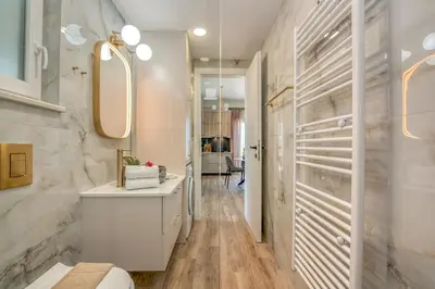 a bathroom with a sink and a mirror at Casa Elea in Kissamos