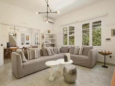 a living room with a couch and a table at Eva's Apartment in Chania Town