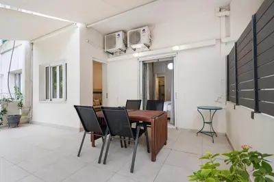 a dining room with a table and chairs at Architects Oasis in Chania Town