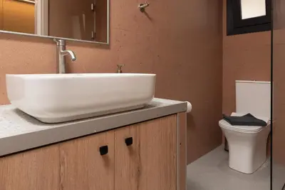 a bathroom with a sink and a toilet at Ikaros City Loft in Chania Town