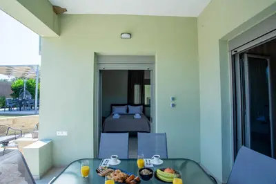 a room with a table with a bowl of food on it at Be Crete - Villa Vayanna in Sirílion