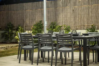 a group of chairs and a table with glasses on it at Be Crete - Villa Vayanna in Sirílion