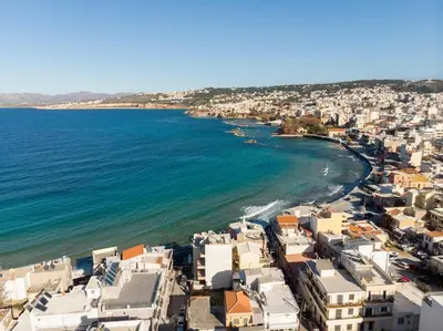 an aerial view of a beach with buildings and the ocean at Cosy apartment in Koum Kapi Beach in Chania Town