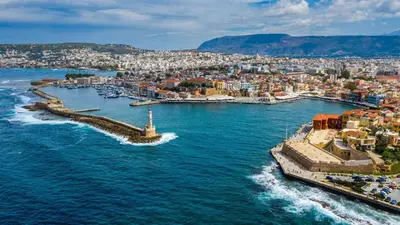an aerial view of a city on the water at Stone House by the Sea in Tavronitis