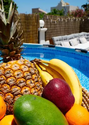 a bunch of fruit in a swimming pool at IKARUS apartment with courtyard & pool in Chania in Stérnai