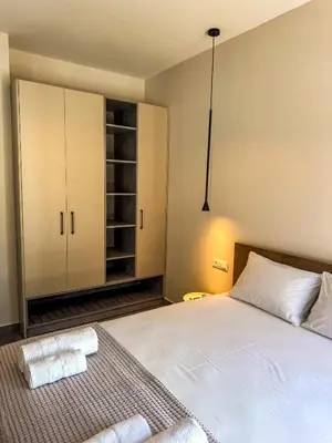a bedroom with a bed with two towels on it at Gialos Villas Paleochora in Palaiochóra