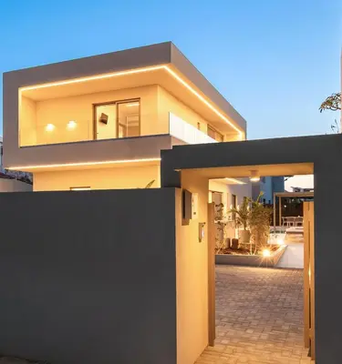 a modern house with a black and yellow facade at Sea Princessa Villa in Chania Town