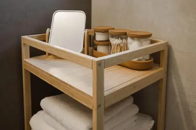 a wooden shelf with a mirror and some towels at Blue Haven Chania Apt in Chania Town