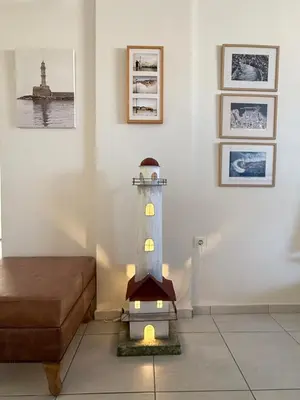 a lighthouse toy in a room with a bed at Chania Memories Apartment in Chania Town