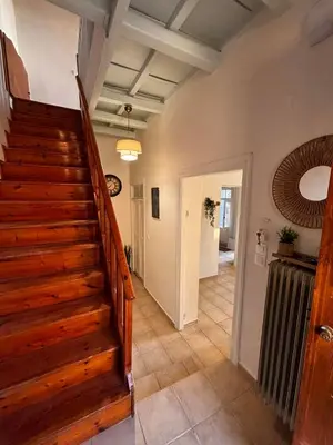 a hallway with a staircase in a house at Yellowstone Chania in Chania Town