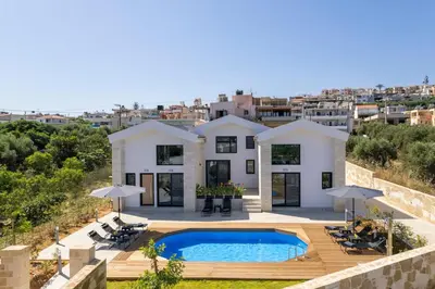 an aerial view of a house with a swimming pool at NEA Dreamy Houses in Agia Marina Nea Kydonias