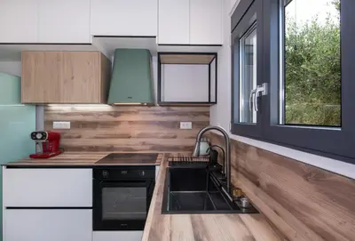 a kitchen with a sink and a window at Glafkos house with pool near the beach in Daratso