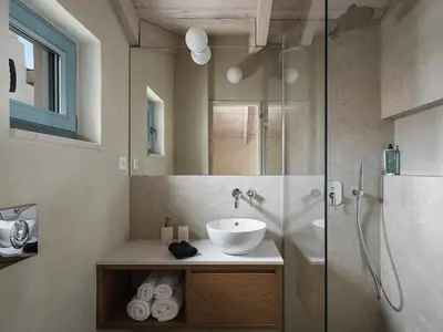 a bathroom with a sink and a shower at Off Apartments in Chania Town