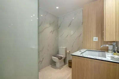 a bathroom with a toilet and a sink at Garden House 2 in Kissamos