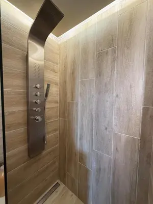a shower with a shower head in a bathroom at Stay near Balos & the seaside in Kaloudhianá