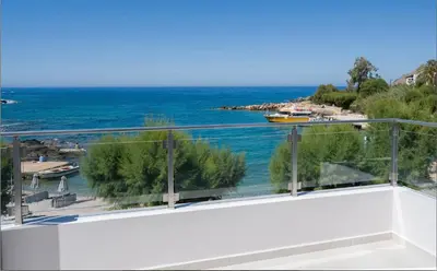 a view of the ocean from the balcony of a house at Phoenix Coastal Heaven in Loutro