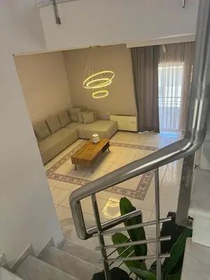a living room with a couch and a table at Casa Ansia Luxury Living 50m from the Beach in Stalos
