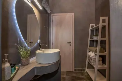 a bathroom with a sink and a mirror at Villa Alma Libre Kissamos in Kissamos