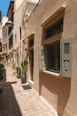 an alley in an old town with a window at Old Town Apt, Balcony, brand new, family, central in Chania Town