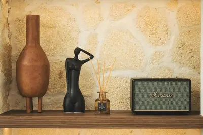 a shelf with a vase and a radio on it at Old Town Apt, Balcony, brand new, family, central in Chania Town