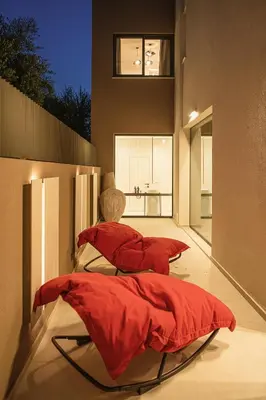 two beds with red comforters in a room at Villa Azahar Serene Luxury Living in Milonianá