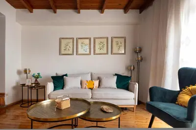 a living room with a couch and a table at Ariadne de Potie Maisonette in Chania Town