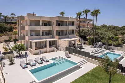 an aerial view of a villa with a swimming pool at Kymélia Luxury Residences With Sea View in Galatás