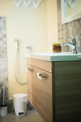 a bathroom with a sink and a toilet at Mera Beachfront House - Falasarna in Falasarna